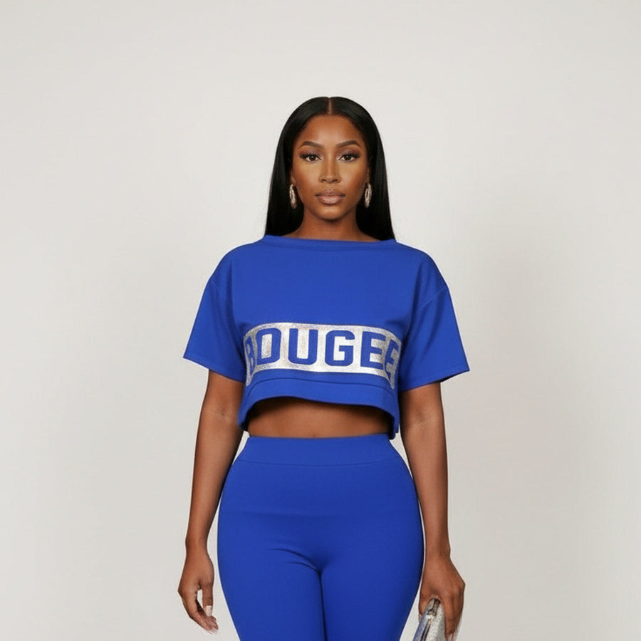 Woman wearing the Bougee royal blue cropped top and matching leggings.