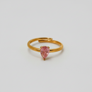 ATORI Lumini gold plated adjustable ring with a teardrop-shaped pink stone on top.