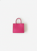 Pink handbag with 'ATORI' branding on a white background