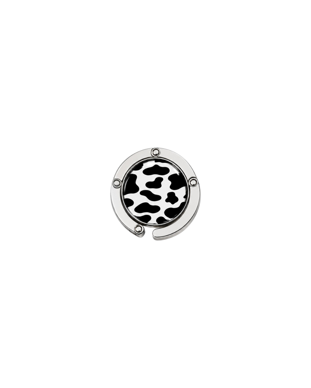 ATORI Wild Card circular silver-toned metal handbag hook accessory with a black and white cow print design, shown on a plain white background.