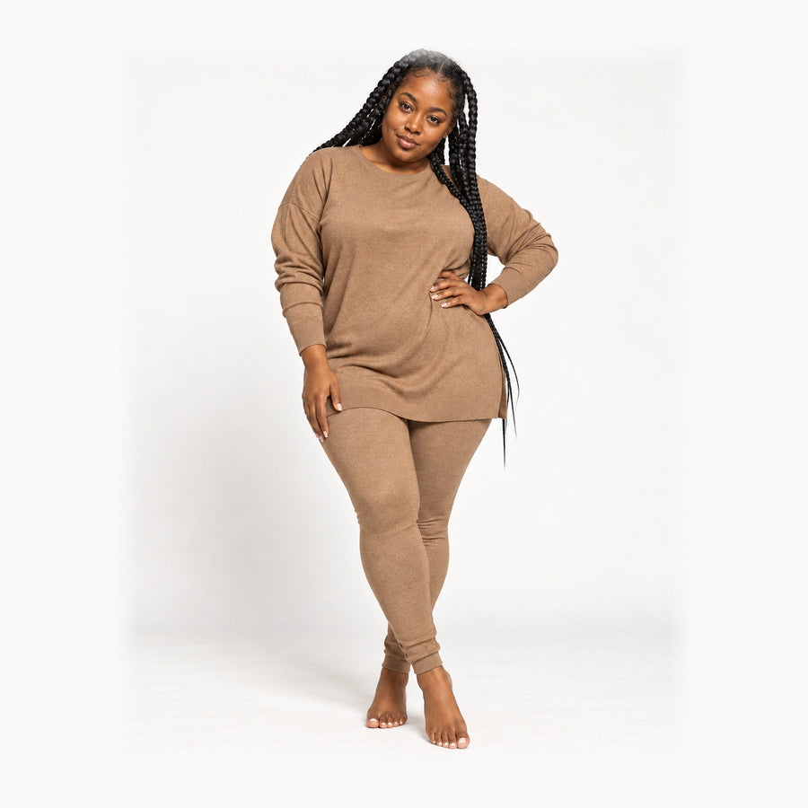 Trisha wearing ATORI NuNu Brown matching set, full-length studio view with head and feet visible.