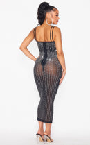 Back view of the Her Dynasty sheer rhinestone midi dress showing the zipper closure.